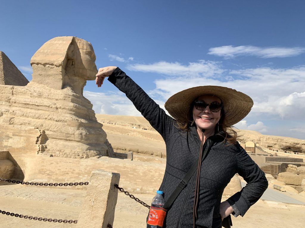 Sphinx kissing debras hand