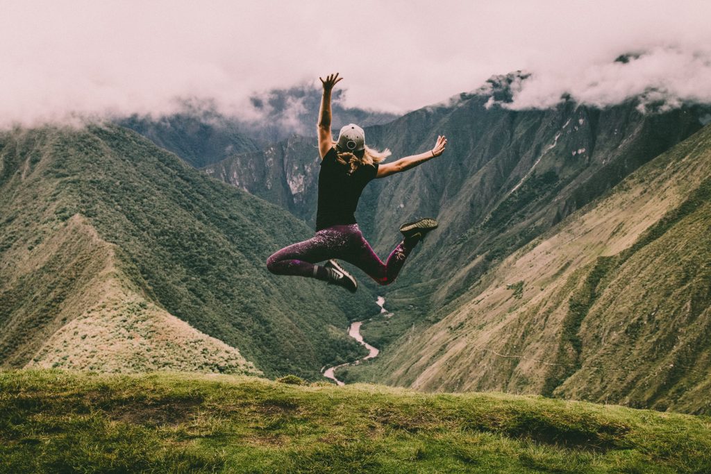 Jumping for joy on a hillside